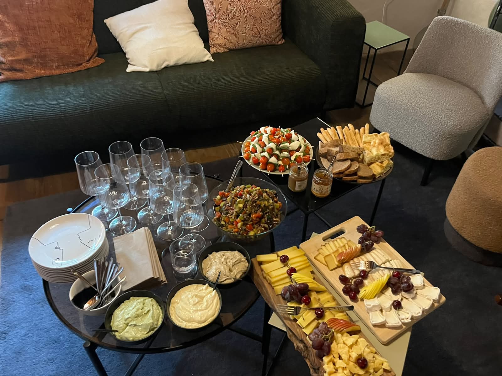 Cheese and charcuterie tasting spread with wine glasses in the lounge