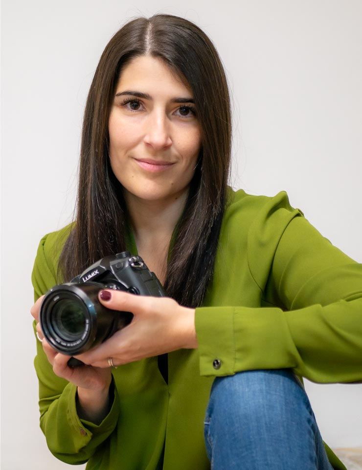 Photographer Giulia Scalfi holding her camera