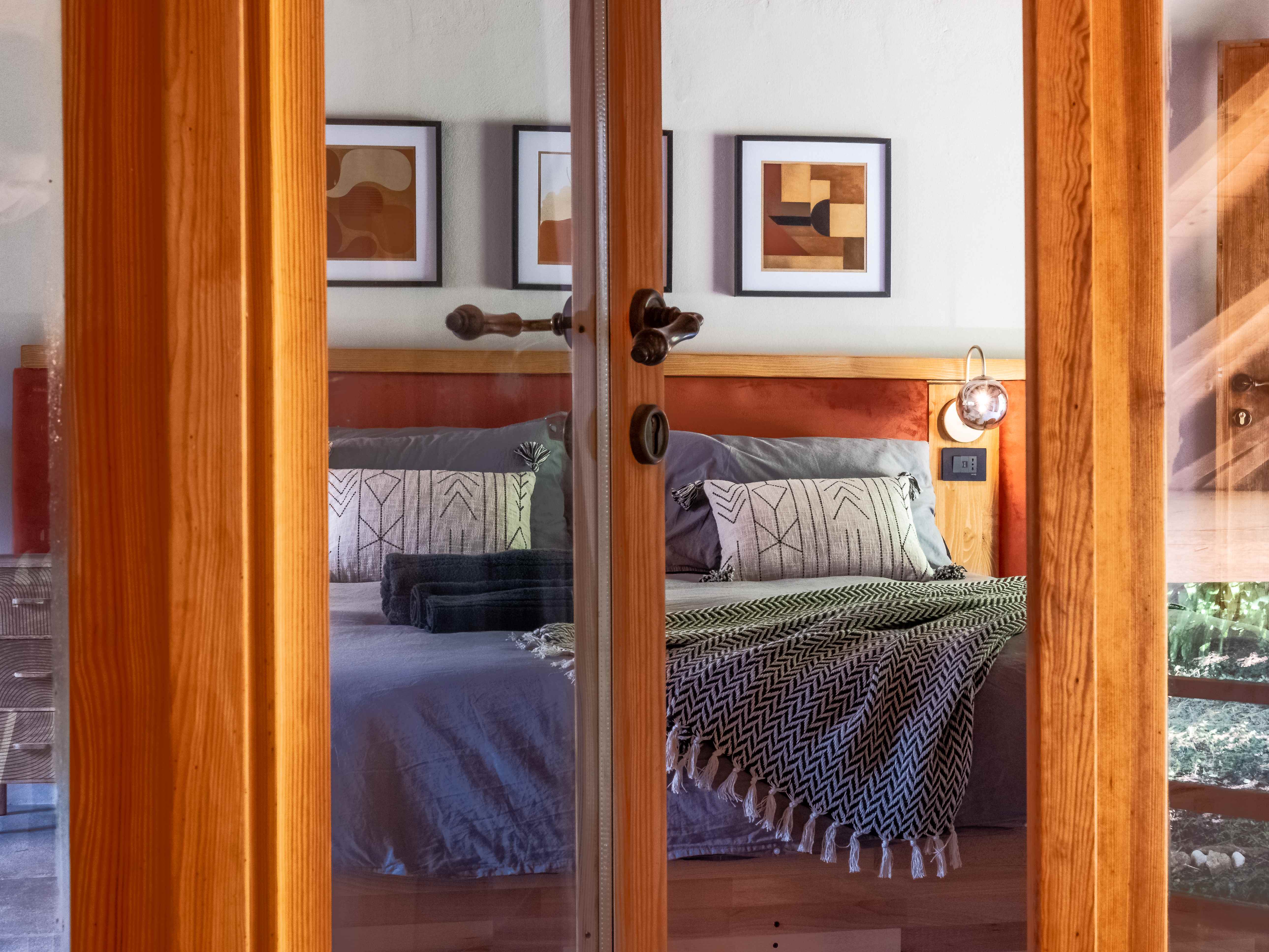 Garden Room 2 viewed through glass doors showing interior lighting